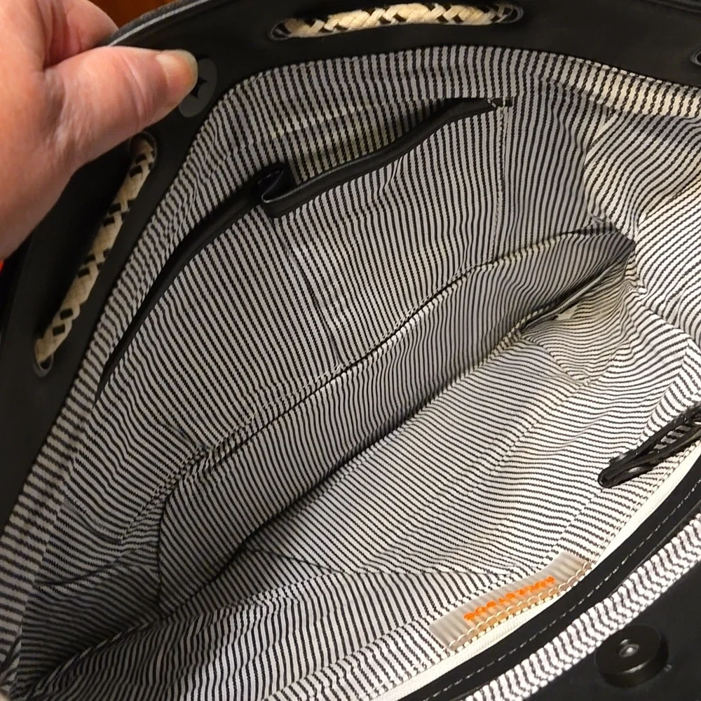 NWT Rocket Dog black backpack with zip top and striped lining.